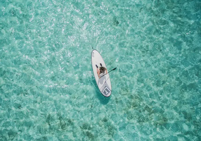 Turquoise sea and paddle