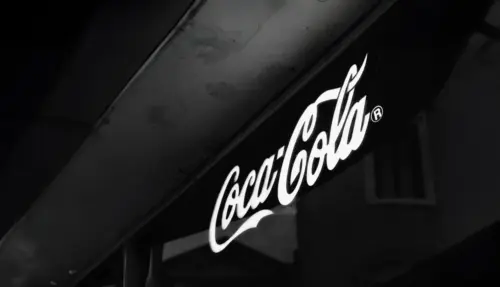black and white illuminated Coca-Cola logo