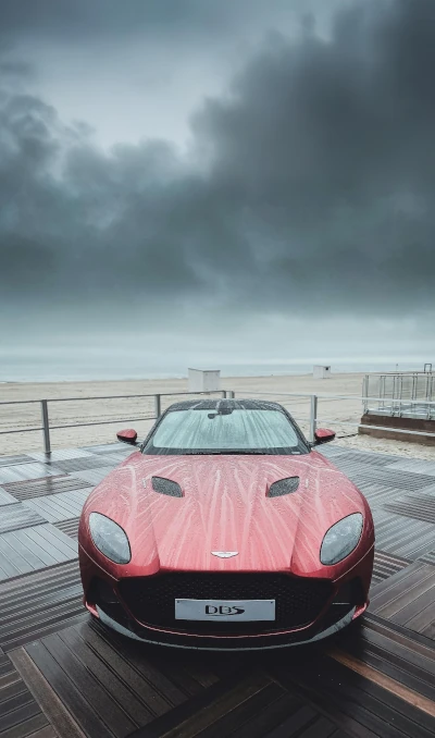 Photograph of an Aston Martin in the rain