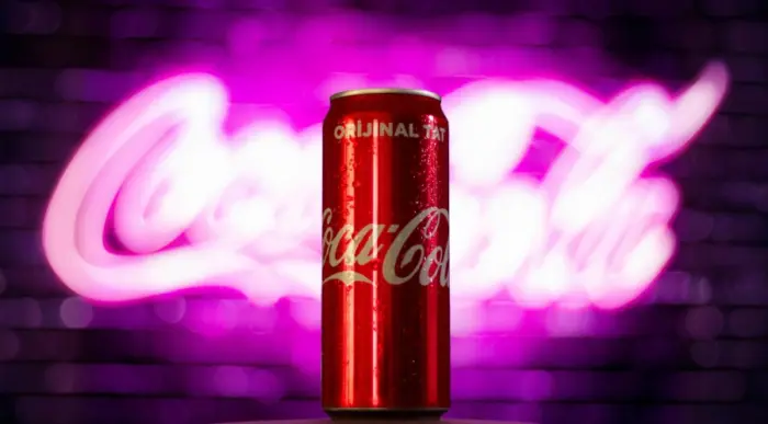 Coca-Cola can background with pink neon logo