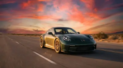 Green Porsche 911 in a desert