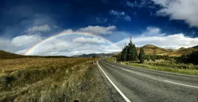 Scenic road and rainbow