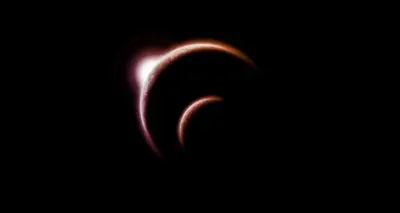 Red planetary eclipse in dark space