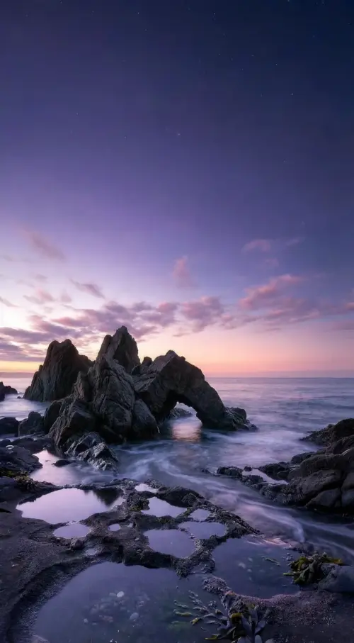 Sea and rocky landscape at sunset wallpaper HD 4K for phone