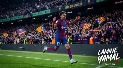Player Lamine Yamal celebrating on a PC background