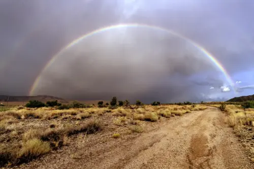 Rainbow landscape in a desert and stormy sky wallpaper HD 4K for desktop