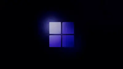 Arrière plan pour Windows 11 logo bleu lueur sombre