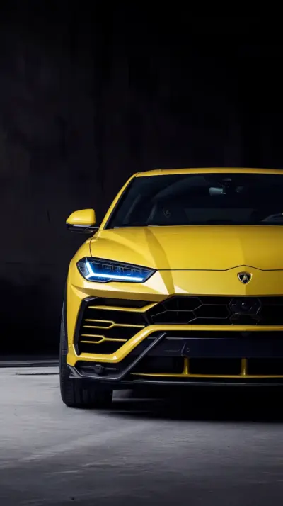 Lamborghini Urus jaune fond noir fonds d’écran HD 4K pour téléphone