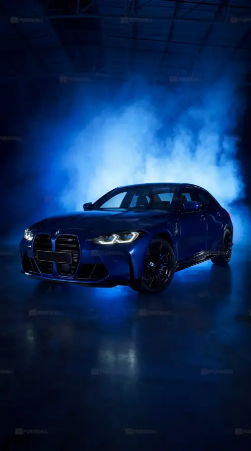 Blue BMW M3 in a nighttime setting