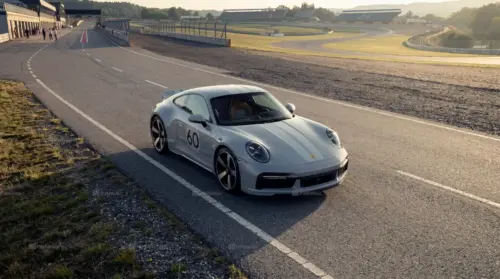 Grey Porsche 911 on a racetrack
