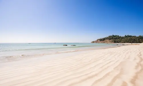 Tropical white sand beach and blue sky wallpaper HD 4K for desktop