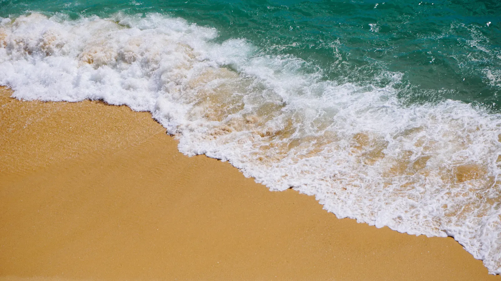 Waves on a golden sand beach wallpaper HD 4K for desktop