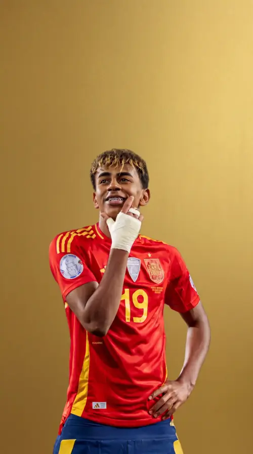 Lamine Yamal wearing the Spain jersey with a gold background wallpaper HD 4K for phone