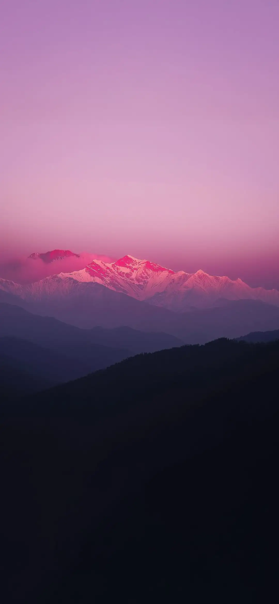Landscape of snow-capped mountains under a pink sky wallpaper HD 4K for phone