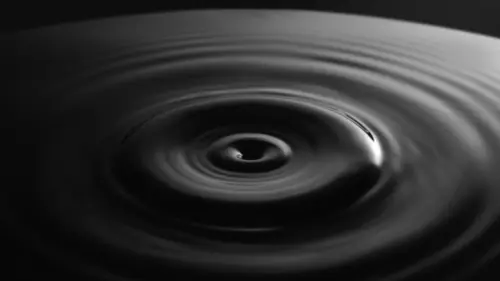 Circular ripples in the black water