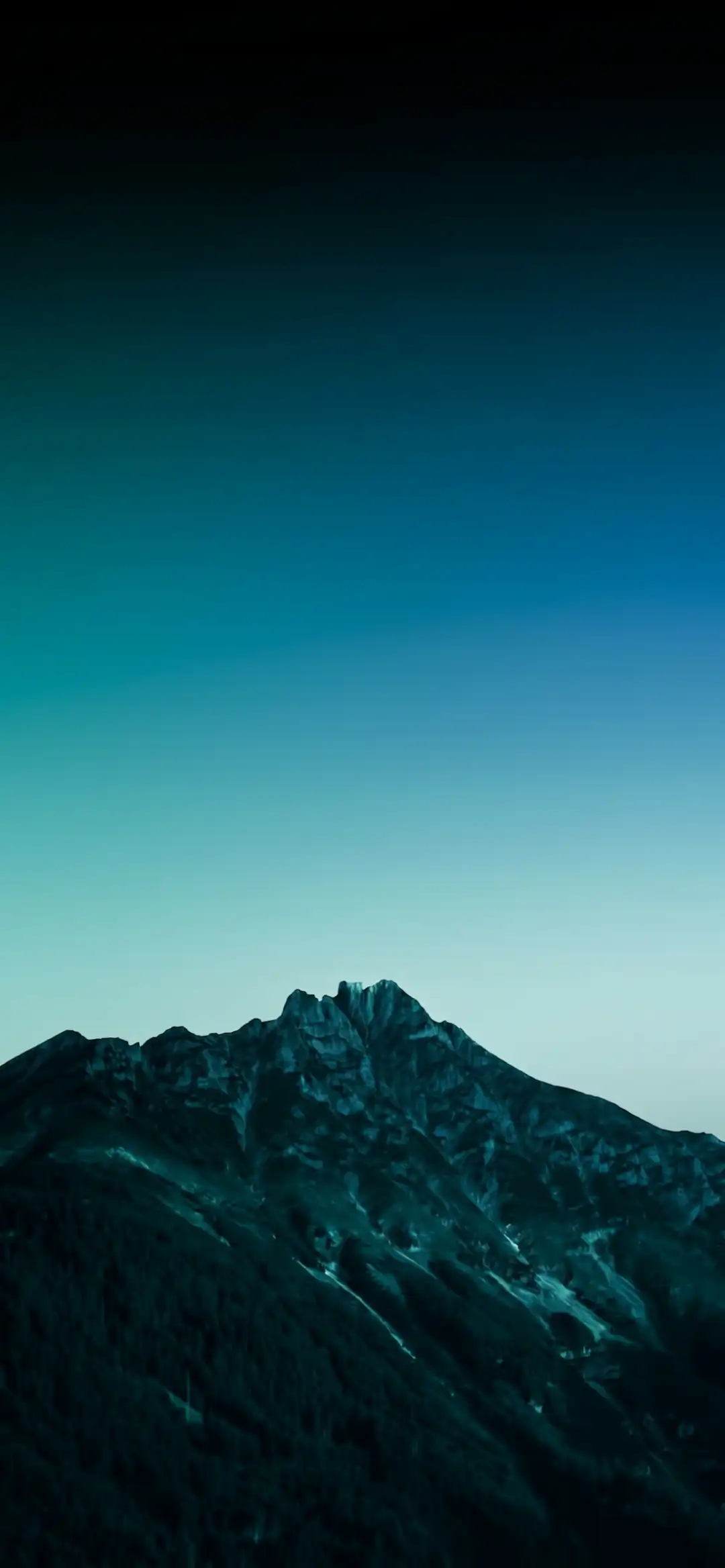 Dark mountain under a blue gradient sky wallpaper HD 4K for phone